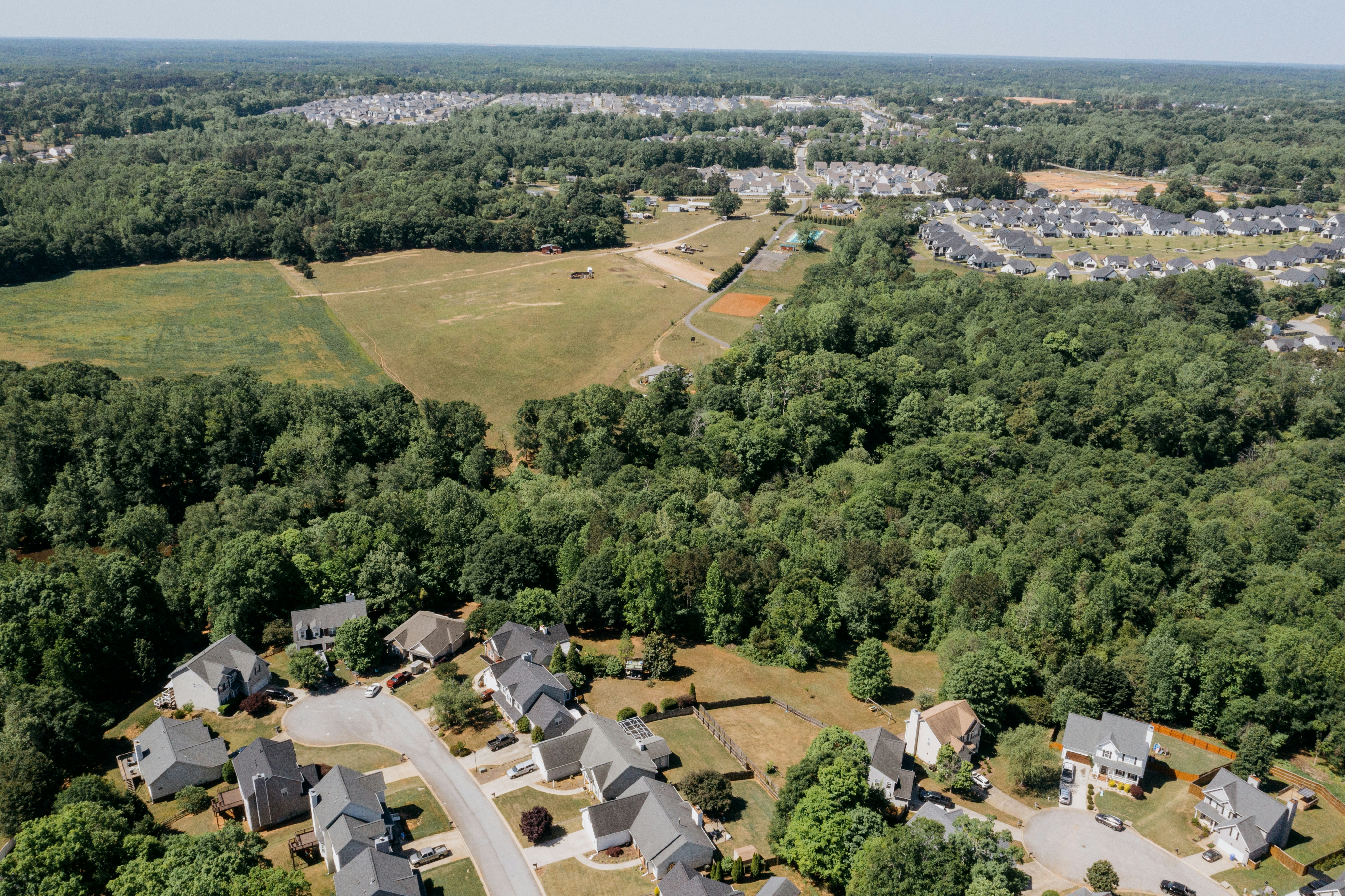 Aerial view of residential land, neighborhoods, and surrounding real estate