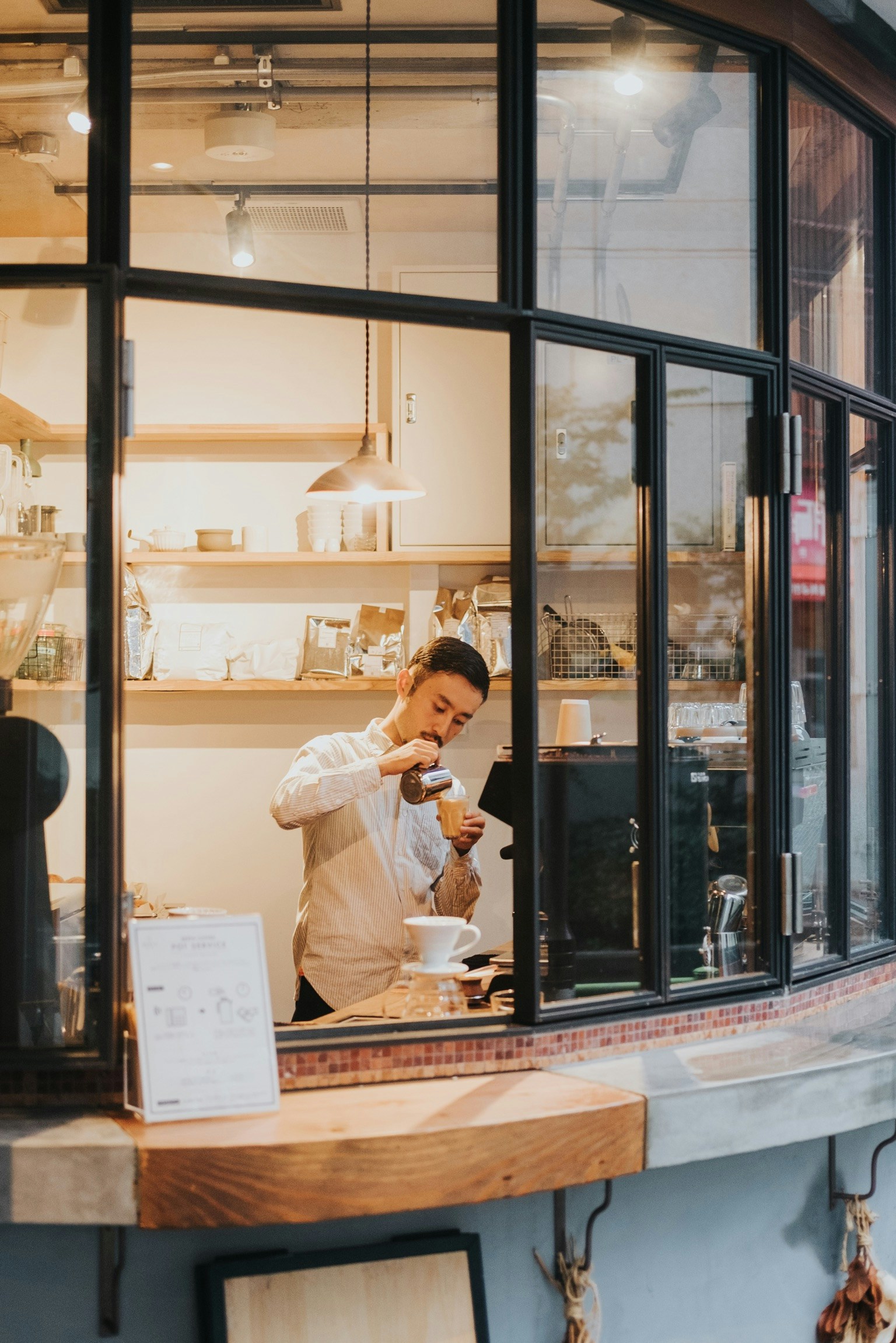 Warm café storefront showing hospitality activation